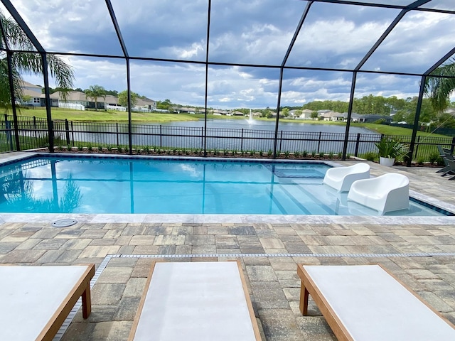 268 Sierras Loop, Saint Augustine, FL 32086 - view of swimming pool with a water view, a fenced backyard, a patio area, and glass enclosure