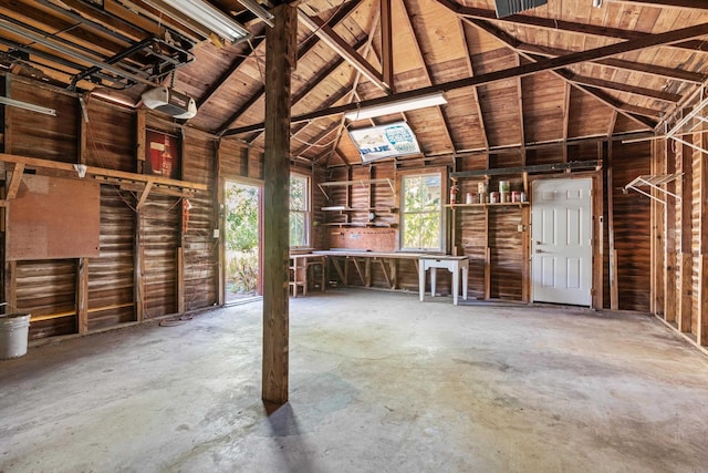 121 Washington St, Saint Augustine, FL 32084 - garage with wooden ceiling and a garage door opener