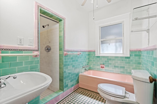 121 Washington St, Saint Augustine, FL 32084 - full bathroom with tile walls, toilet, a stall shower, and a sink