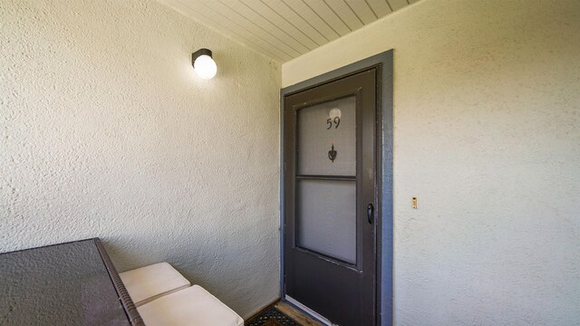 890 A1A Beach Blvd Unit 59, Saint Augustine, FL 32080 - doorway to property with stucco siding