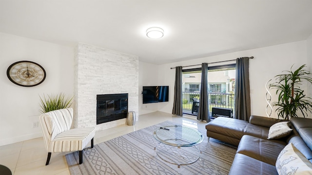 890 A1A Beach Blvd Unit 59, Saint Augustine, FL 32080 - tiled living area with a stone fireplace and baseboards