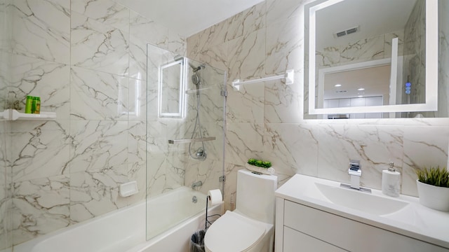 890 A1A Beach Blvd Unit 59, Saint Augustine, FL 32080 - full bath featuring combined bath / shower with glass door, tile walls, and vanity