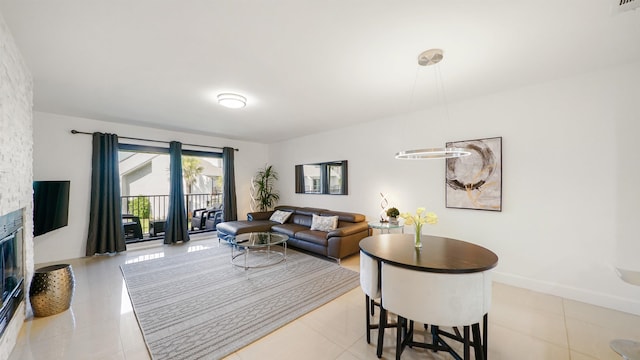 890 A1A Beach Blvd Unit 59, Saint Augustine, FL 32080 - living area featuring tile patterned flooring and a stone fireplace