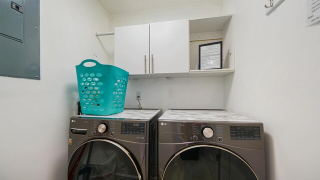 890 A1A Beach Blvd Unit 59, Saint Augustine, FL 32080 - laundry area featuring washer and clothes dryer, electric panel, and cabinet space