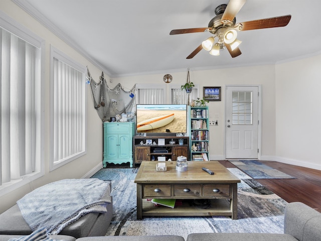 living room with hardwood / wood-style flooring, ceiling fan, and ornamental molding