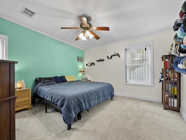 bedroom with ceiling fan, light carpet, and ornamental molding