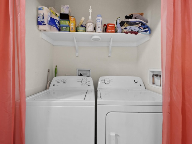 washroom with washer and clothes dryer