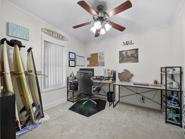 home office with ceiling fan, ornamental molding, and light carpet