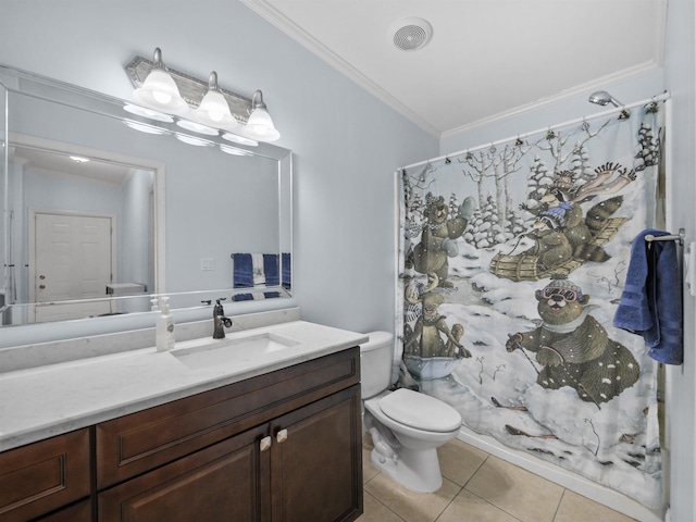 bathroom featuring tile patterned floors, crown molding, vanity, and toilet