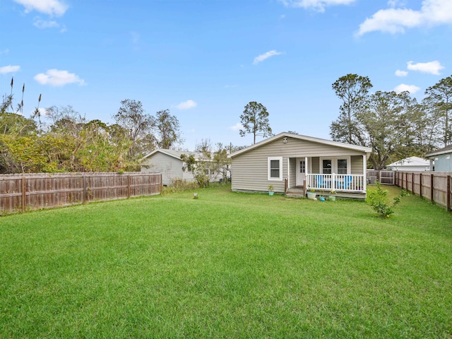 back of property featuring a lawn