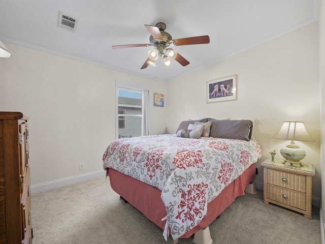 bedroom featuring carpet flooring, ceiling fan, and crown molding