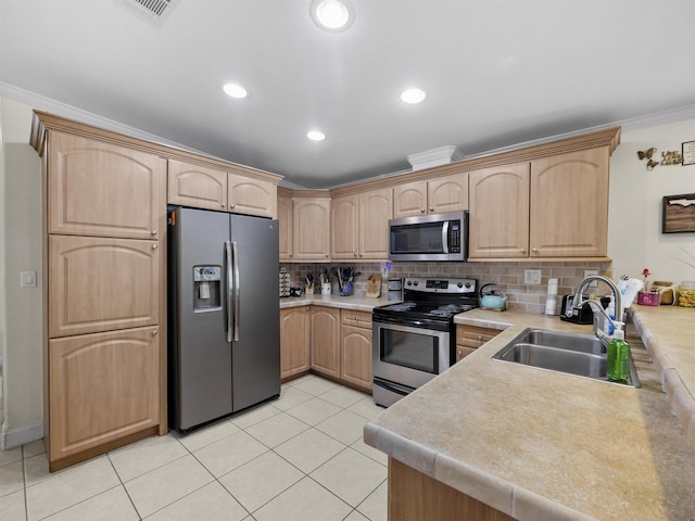 kitchen with backsplash, light brown cabinets, sink, and stainless steel appliances