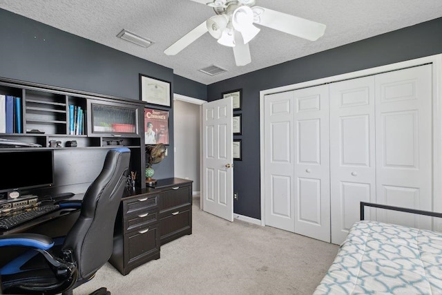 241 N Hidden Tree Dr, Saint Augustine, FL 32086 - bedroom with an office area, a closet, light colored carpet, ceiling fan, and a textured ceiling