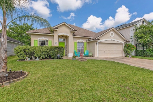 241 N Hidden Tree Dr, Saint Augustine, FL 32086 - view of front of home with stucco siding, concrete driveway, a garage, and a front yard