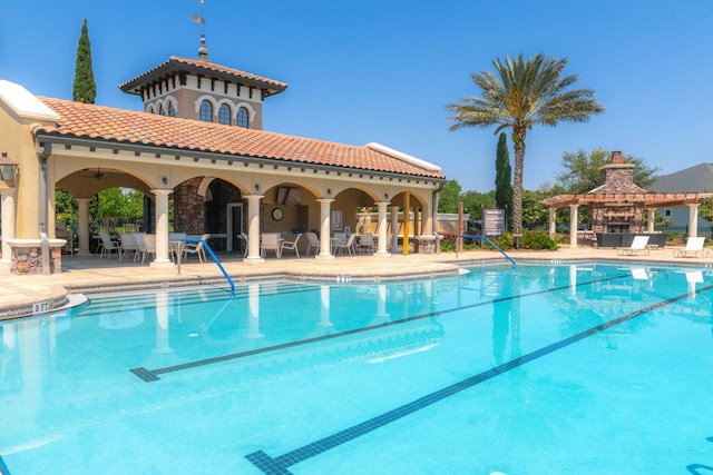 view of swimming pool featuring a gazebo, a patio area, and ceiling fan