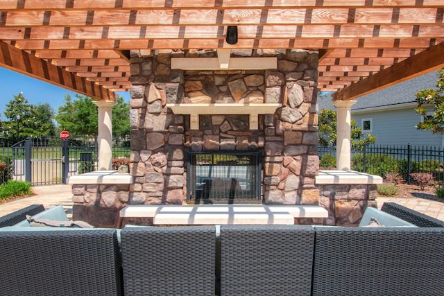 view of patio / terrace with a pergola and an outdoor living space with a fireplace