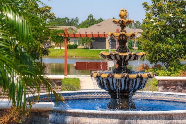 view of home's community with a water view