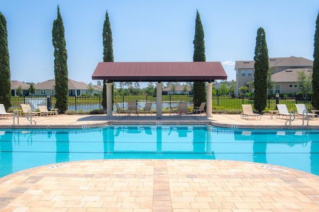 view of swimming pool with a gazebo and a patio area