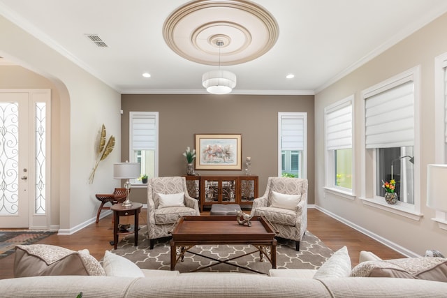 interior space featuring crown molding and wood-type flooring