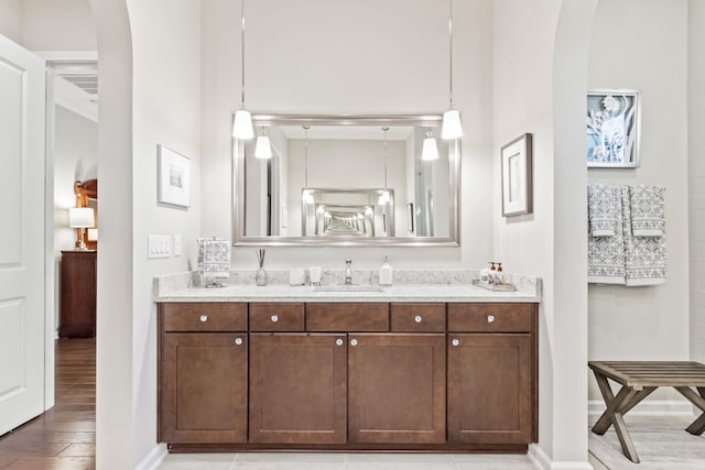 bathroom with vanity and hardwood / wood-style floors