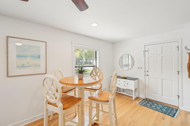 dining area with ceiling fan and light hardwood / wood-style floors