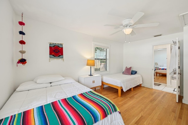 bedroom with hardwood / wood-style flooring and ceiling fan