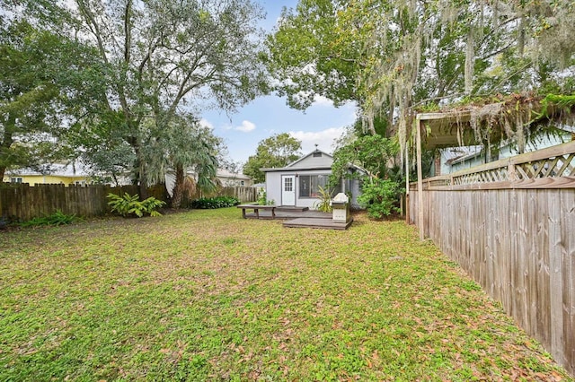 view of yard with a wooden deck