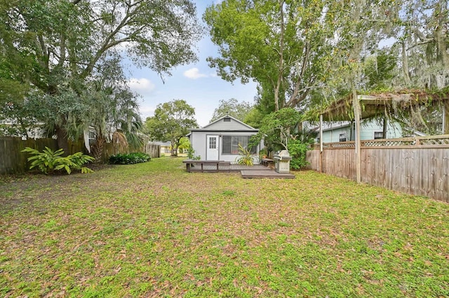 view of yard featuring a wooden deck