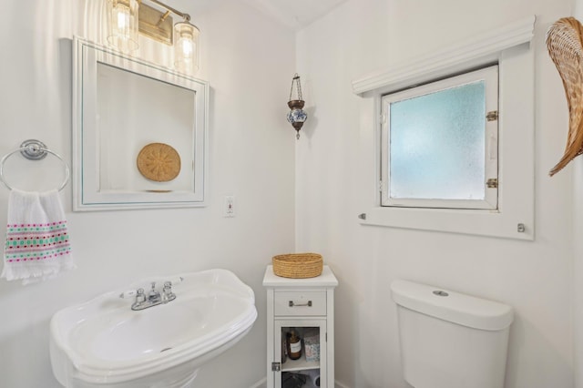 bathroom featuring toilet and sink