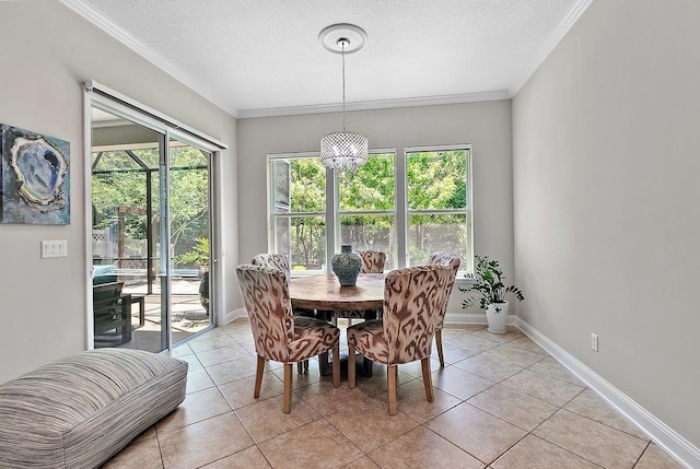 dining area featuring a textured ceiling, baseboards, and ornamental molding