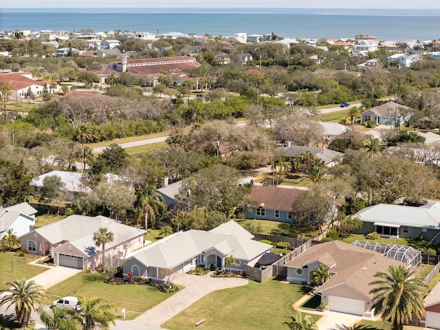 drone / aerial view with a water view and a residential view