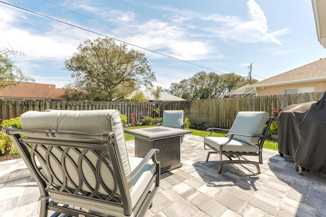 view of patio with a fenced backyard and area for grilling