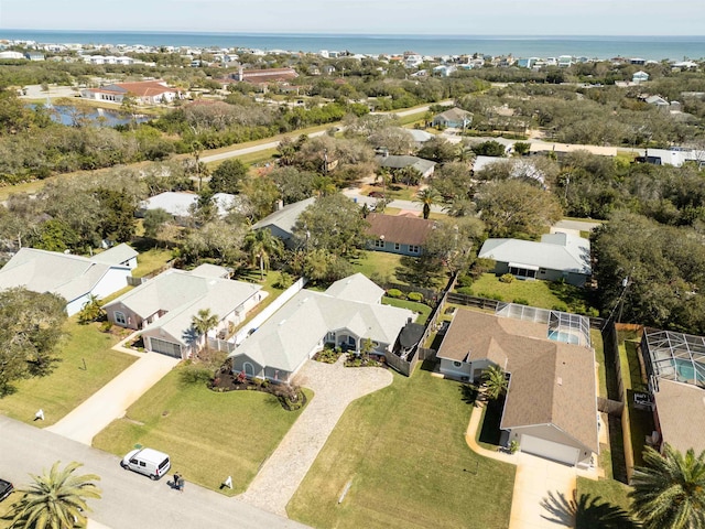 birds eye view of property featuring a water view and a residential view