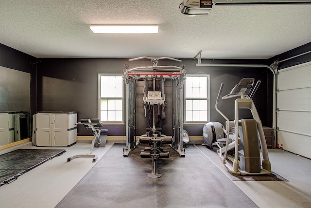 workout room featuring a textured ceiling and a garage