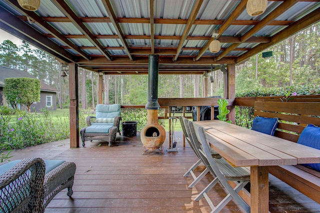 wooden deck featuring outdoor dining area