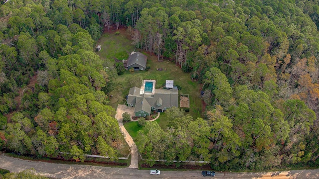 aerial view featuring a view of trees