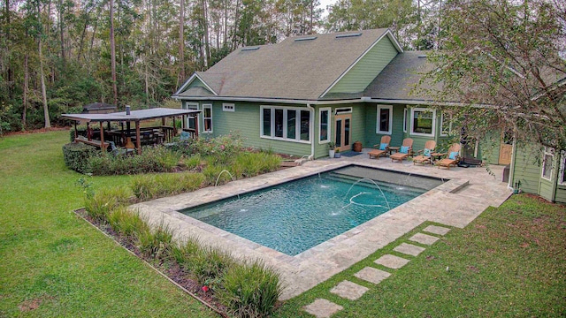 pool featuring a patio area, a lawn, and a gazebo