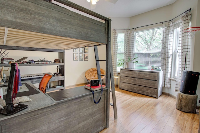 home office featuring baseboards and wood finished floors