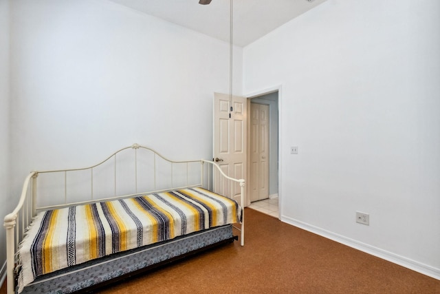 bedroom featuring ceiling fan and carpet floors