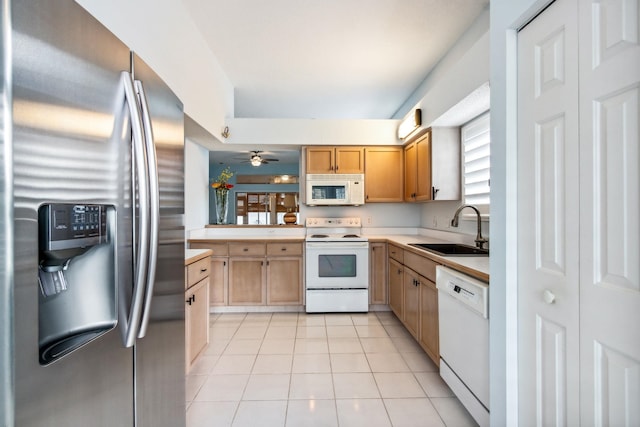 kitchen with light tile patterned flooring, white appliances, ceiling fan, and sink