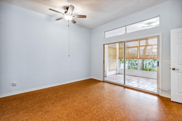 spare room featuring ceiling fan and a textured ceiling