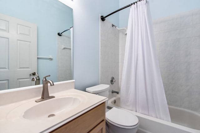 full bathroom featuring vanity, toilet, and shower / tub combo