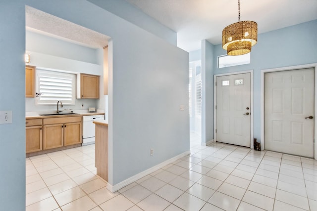 tiled entrance foyer featuring sink