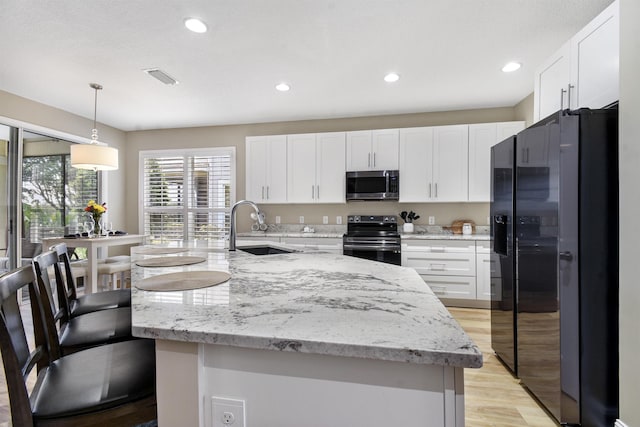 1125 S Marsh Wind Way, Ponte Vedra Beach, FL 32082 - kitchen featuring visible vents, recessed lighting, white cabinets, a sink, and stainless steel appliances