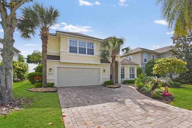 1125 S Marsh Wind Way, Ponte Vedra Beach, FL 32082 - traditional home with decorative driveway, a garage, stucco siding, and a front yard