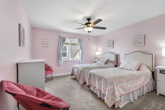 1125 S Marsh Wind Way, Ponte Vedra Beach, FL 32082 - bedroom featuring a ceiling fan, baseboards, light colored carpet, and a textured ceiling