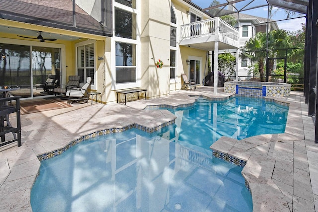 1125 S Marsh Wind Way, Ponte Vedra Beach, FL 32082 - view of pool featuring ceiling fan, a patio area, a pool with connected hot tub, and glass enclosure
