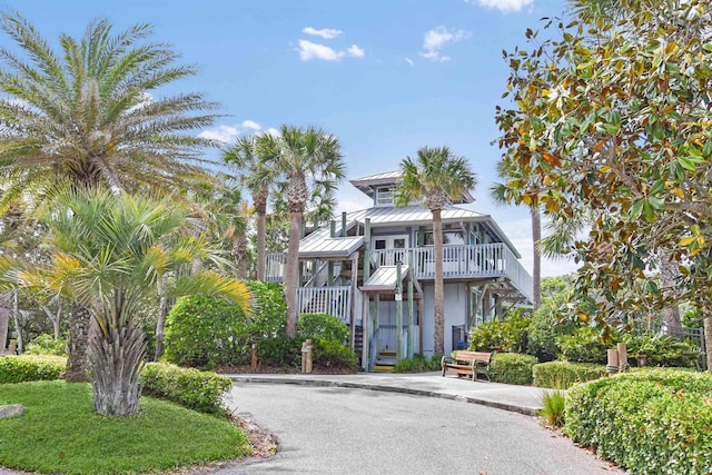 1125 S Marsh Wind Way, Ponte Vedra Beach, FL 32082 - view of front of property with stairs, stucco siding, a standing seam roof, and metal roof