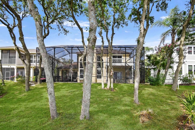 1125 S Marsh Wind Way, Ponte Vedra Beach, FL 32082 - rear view of house with a yard and glass enclosure