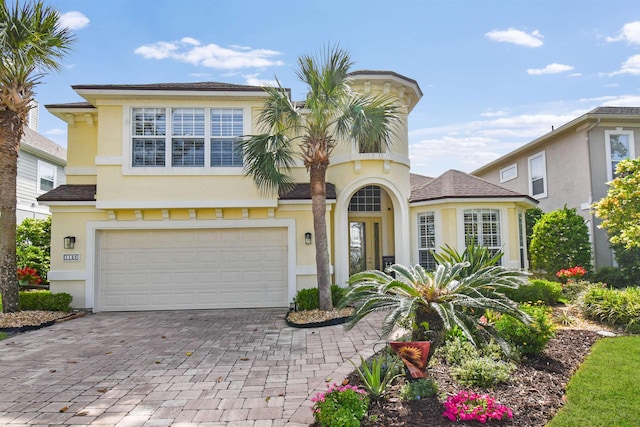 1125 S Marsh Wind Way, Ponte Vedra Beach, FL 32082 - view of front of house featuring decorative driveway, a garage, and stucco siding